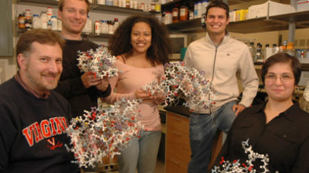 University of Virginia Biomedical Sciences Graduate Program student in lab displaying their work.