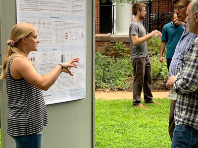UVA Cell and Molecular Biology grad student talking about her poster.