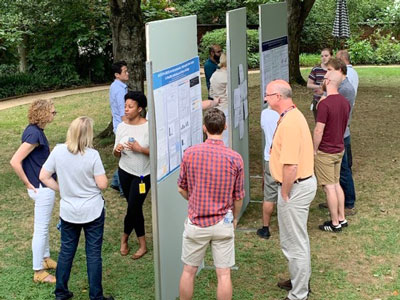 UVA Cell and Molecular Biology posters and people at a poster session held on the grounds of UVA.