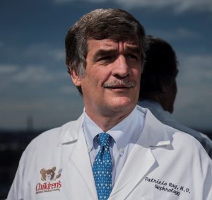 Patricio E. Ray, MD white coat headshot
