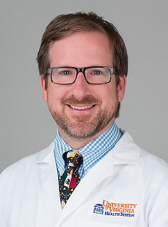 Sean R. Moore, MD white coat head shot