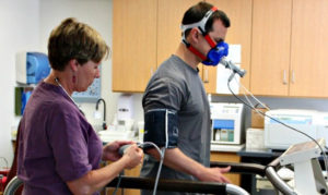 Photo of UVA patient and researcher conducting tests for breathing analysis.